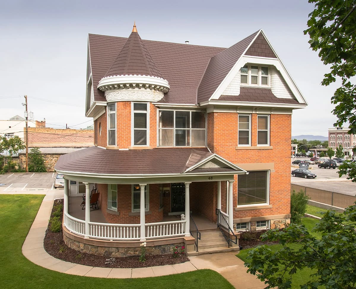 Brown roof on a Victorian home with turret