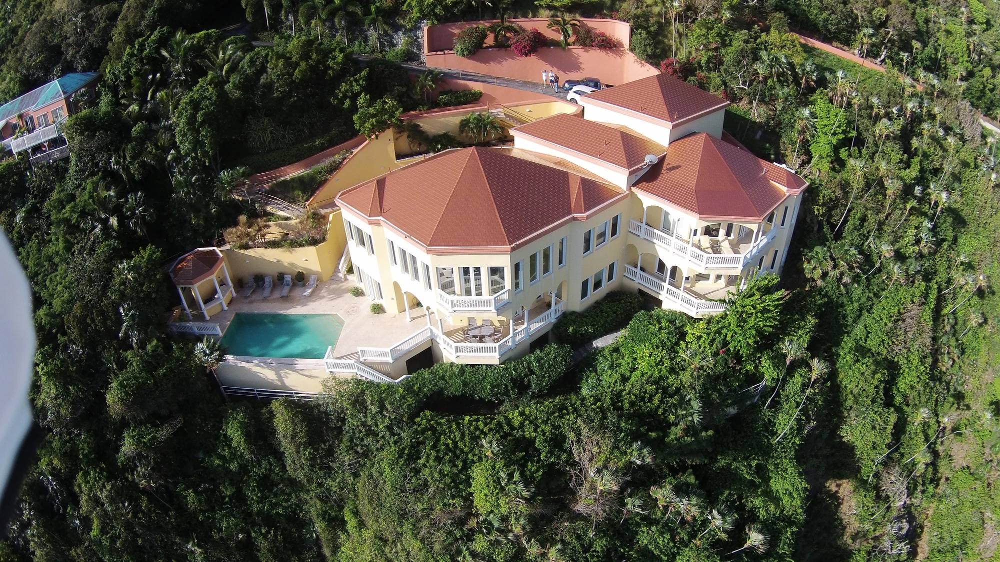 Red roof on a large estate viewed from above