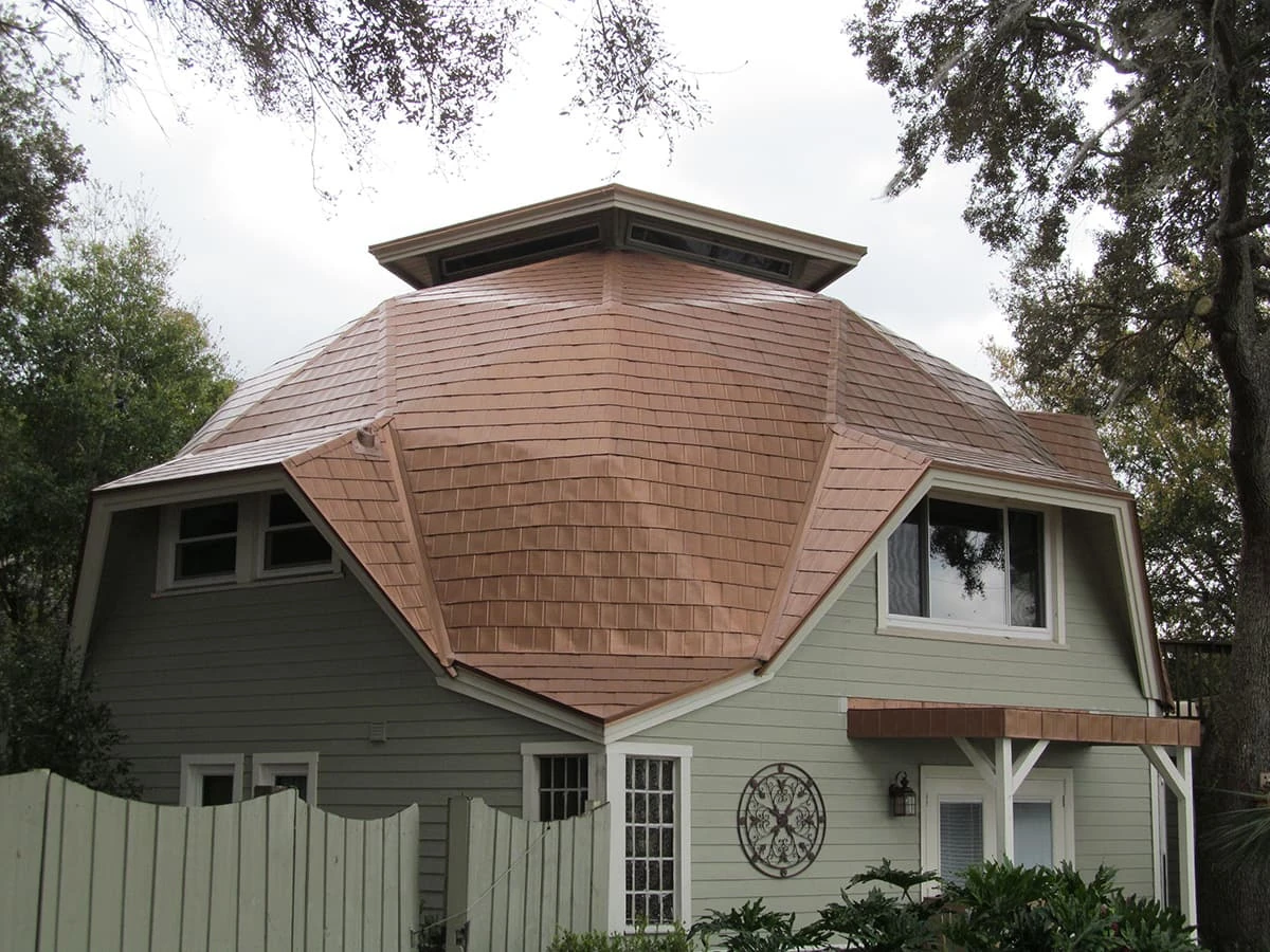 Copper-tone roof on an octagonal home