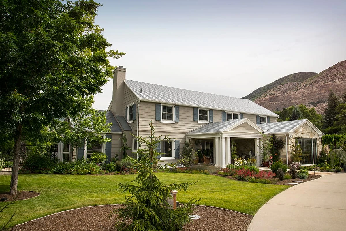 Gray roof on a landscaped two-story home