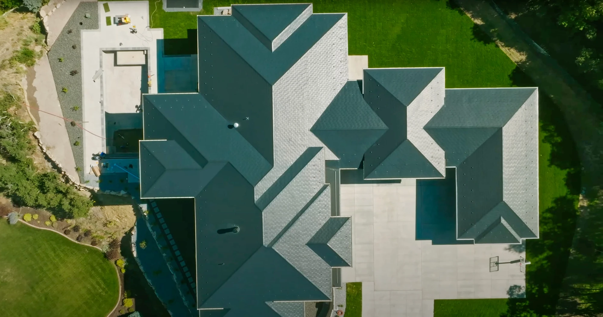 Teal roof hips and valleys aerial view