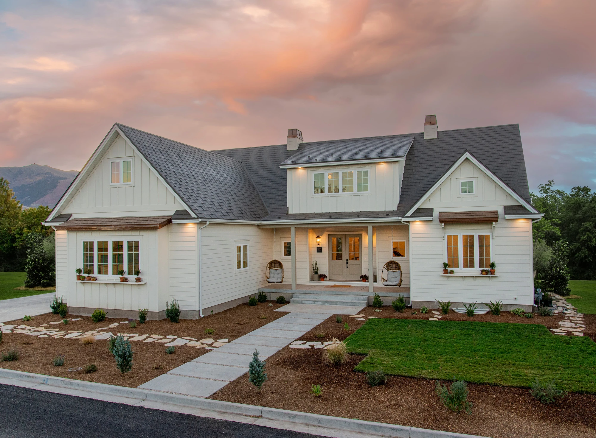 Roof on a white farmhouse at sunset