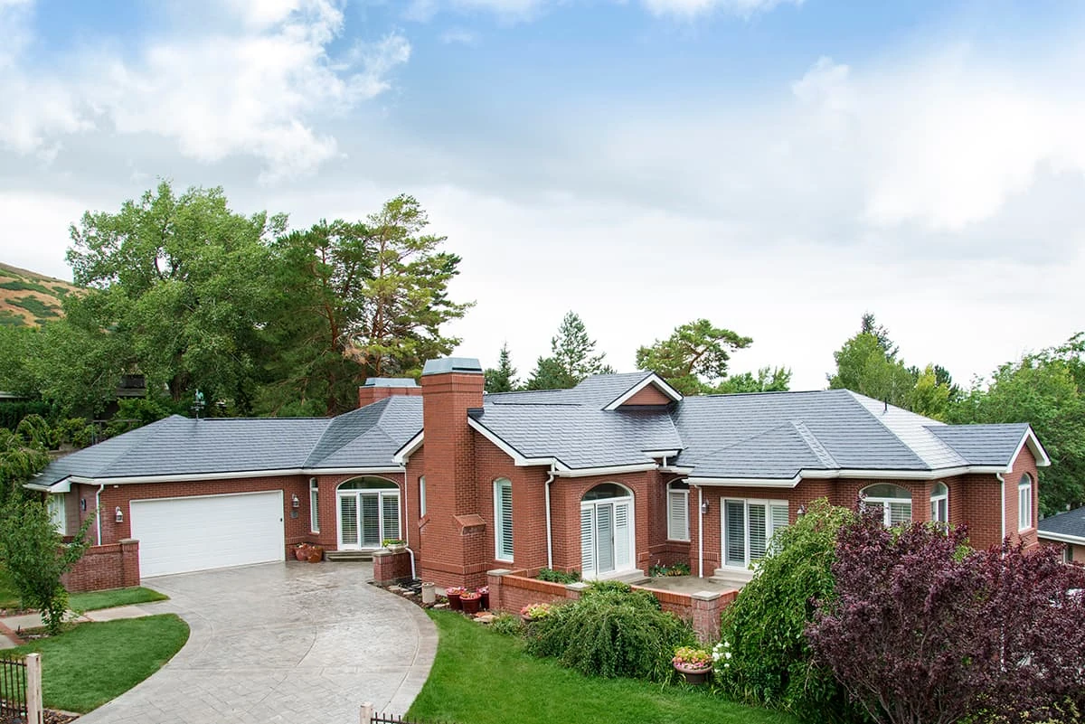 Blue-gray roof on a brick ranch